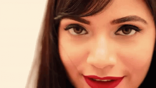 Grinning Girl Winking GIF