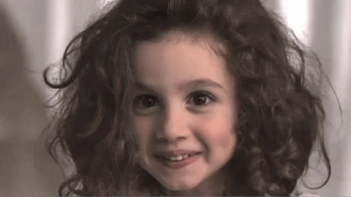 Grinning Girl With Messy Hair GIF