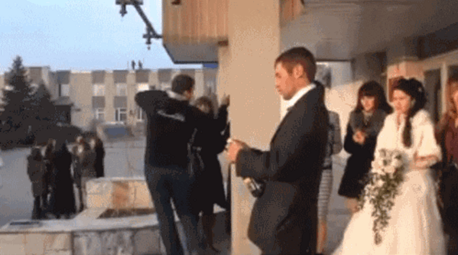 Groom Epic Fail Champagne Popping GIF