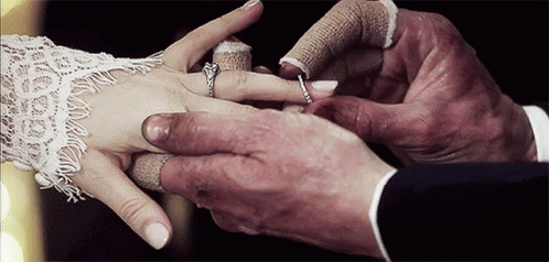Groom Putting Wedding Ring On Bride GIF