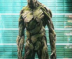 Groot Statue in Front of Green Wall