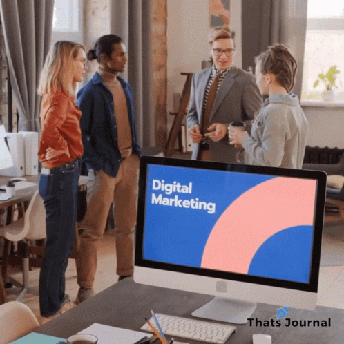Group Around Computer Monitor Saying Digital Marketing GIF