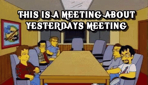 Group Around Table With This Is a Meeting About Yesterday's Meeting