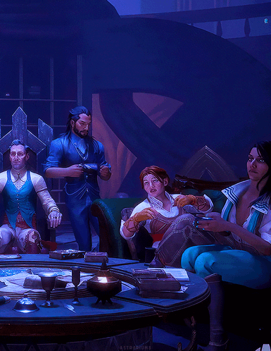 Group at Table in Dark Room Blue Background