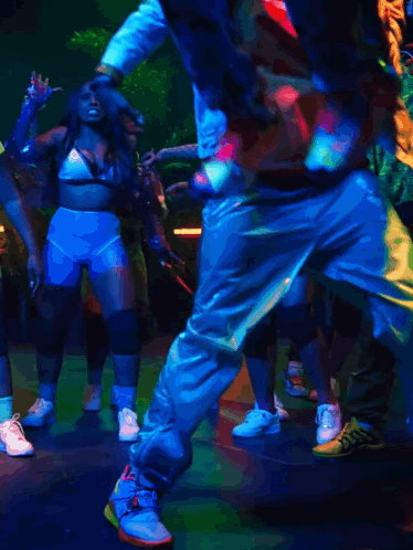 Group Dancing In Dark Room With Blue Light GIF