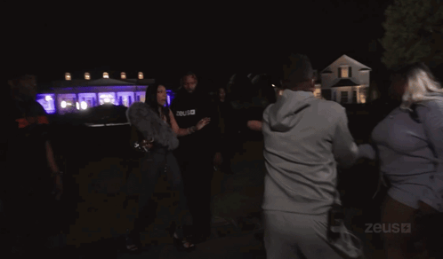 Group Dancing In Dark Room With Zeus GIF