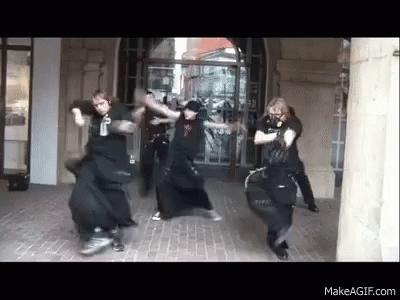 Group Dancing in Front of Building