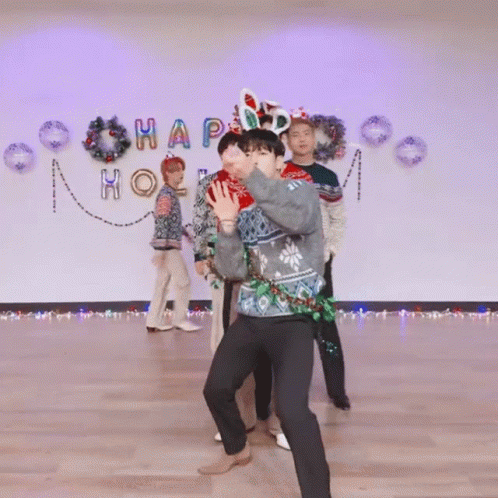 Group Dancing in Front of Happy Wall