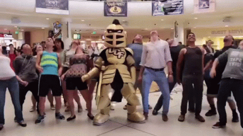 Group Dancing in Front of Knight Mascot