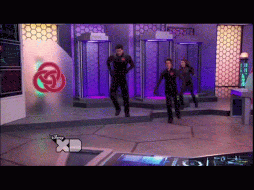Group Dancing in Front of XD Sign
