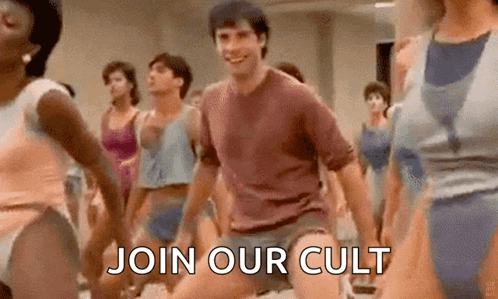 Group Dancing in Gym with Man in Center