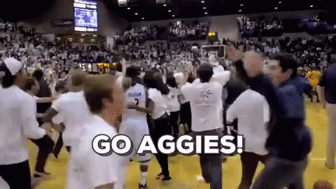 Group Dancing on Basketball Court Go Aggies