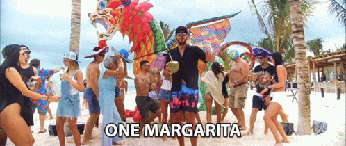 Group Dancing on Beach with One Margarita
