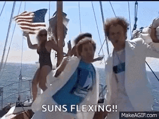 Group Dancing on Boat Holding American Flag