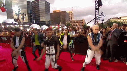 Group Dancing On Red Carpet With Number 28 Shirt GIF