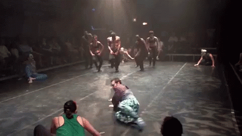 Group Dancing On Stage One In Green Shirt GIF