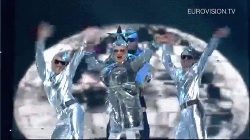 Group Dancing on Stage Under Moon