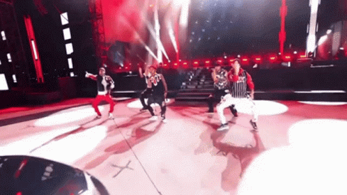 Group Dancing On Stage With Number 30 Shirt GIF