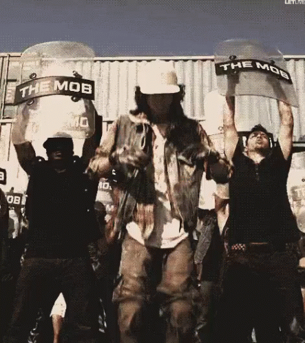 Group Holding Riot Shields Saying Mob