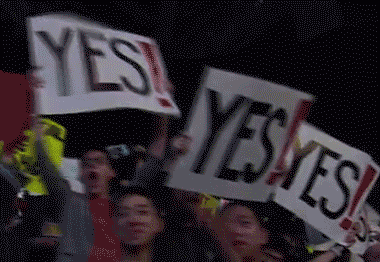 Group Holding Signs Saying Yes