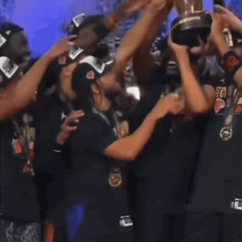 Group Holding Trophy, Person in Crying Face Shirt