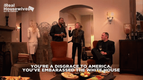 Group in Living Room Saying You're a Disgrace to America