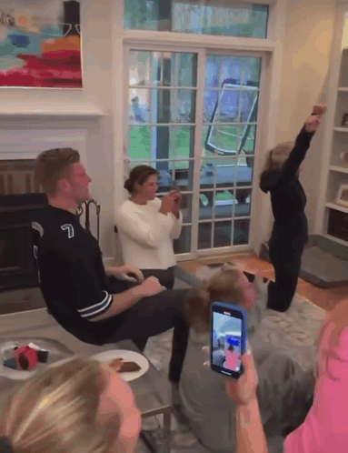 Group In Living Room With Number 7 Jersey GIF