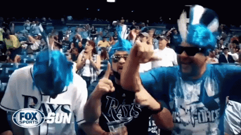 Group In Rays Shirts Dancing In Crowd GIF
