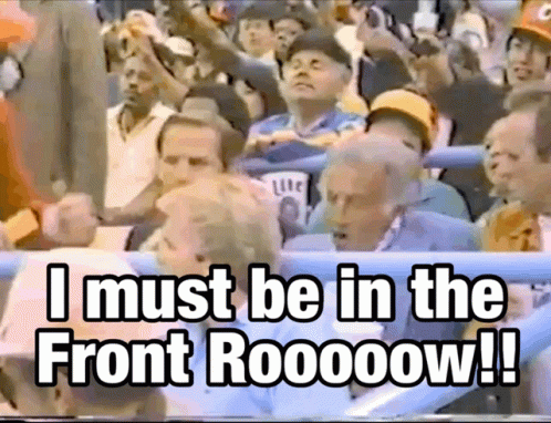 Group in Stadium Saying I Must Be in the Front Row