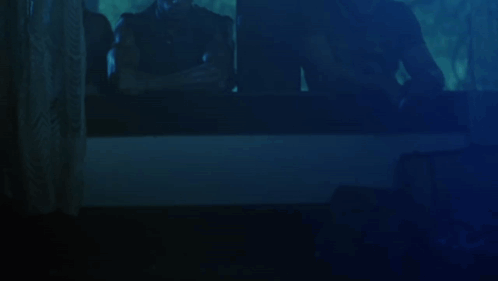 Group Looking Out Window at Night