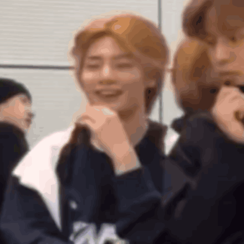 Group Member Smiling And Covering Mouth GIF