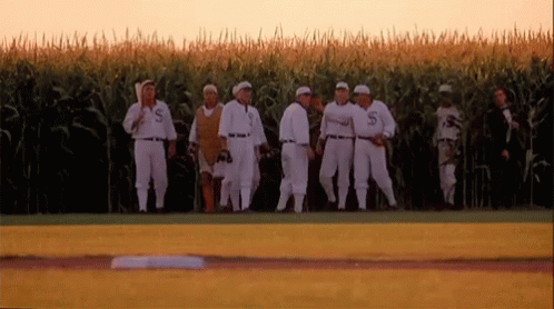 Group Of Baseball Players Standing On Field GIF