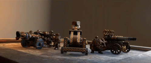 Group Of Cannons On Wooden Table GIF