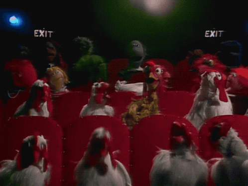 Group of Chickens Watching Movie in Theater