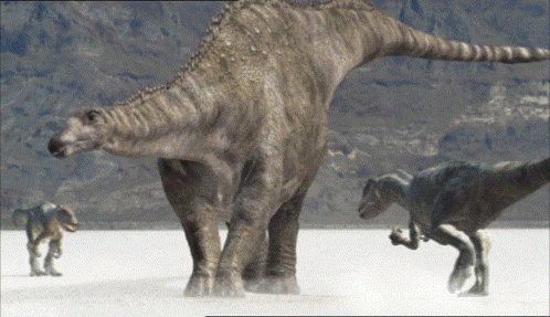 Group of Dinosaurs Standing on Sand