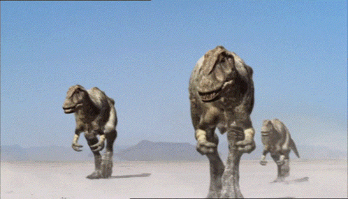 Group of Dinosaurs Walking Through Desert