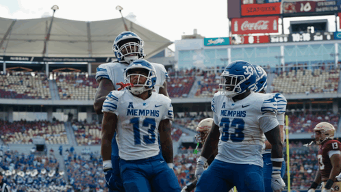 Group of Football Players in Memphis Jerseys