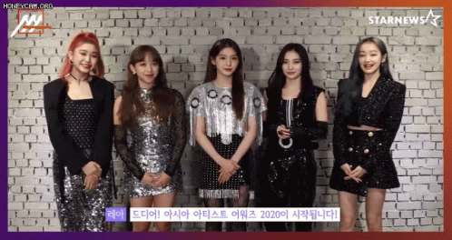Group of Girls in Front of Brick Wall With Starnews