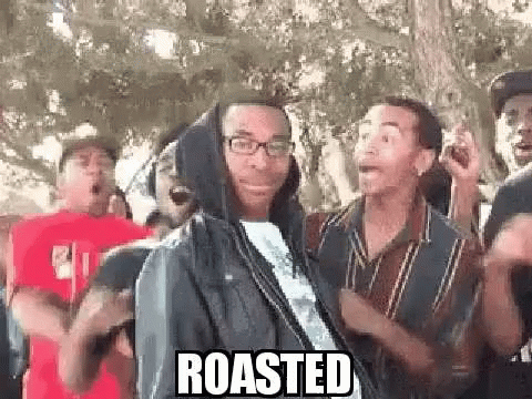 Group Of Men Around Hooded Man With Glasses GIF