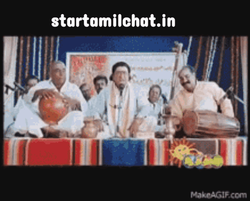 Group Of Men Around Table With StartTamilChat Sign GIF