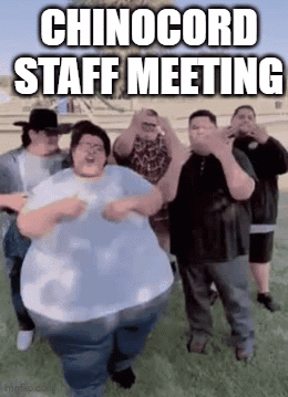 Group of Men Dancing in Field Chinocord Staff Meeting