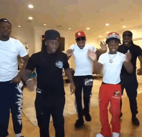 Group of Men Dancing in Living Room