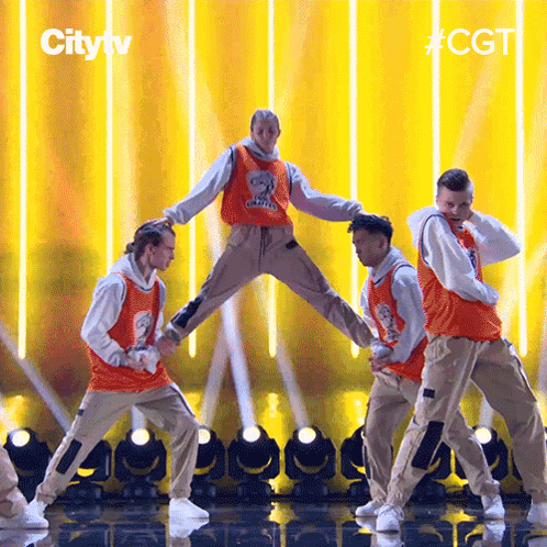 Group of Men Dancing on Stage With City TV Logo
