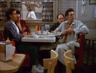 Group of Men Eating at Diner Table
