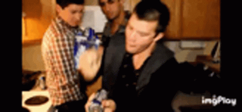 Group Of Men Holding Bottles In Kitchen GIF