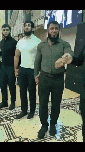 Group Of Men Holding Hands And Dancing GIF