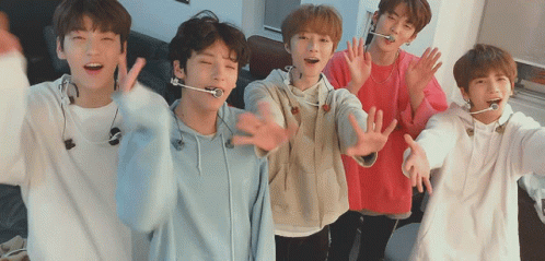 Group of Men Holding Microphones With Fan