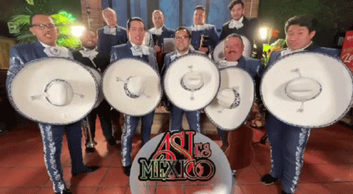 Group of Men in Front of Mexico Banner