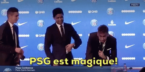 Group of Men in Front of PSG Est Magique Wall