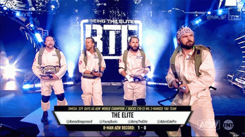 Group of Men in Front of The Elite Sign